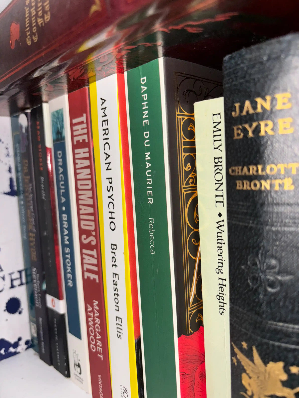 Pre-loved classic literature books displayed on wooden shelf UK