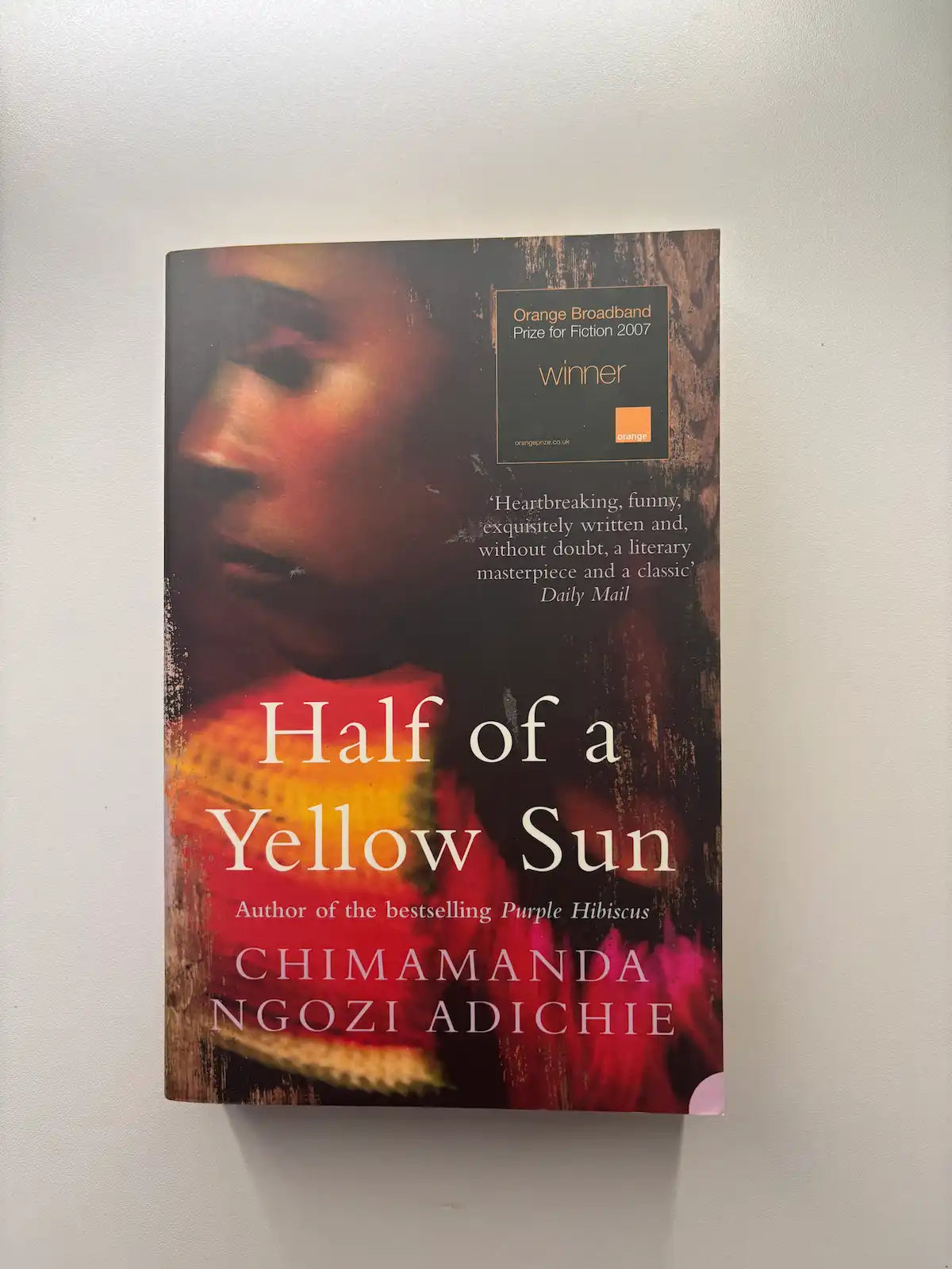 Half of a Yellow Sun by Chimamanda Ngozi Adichie historical fiction book front cover UK