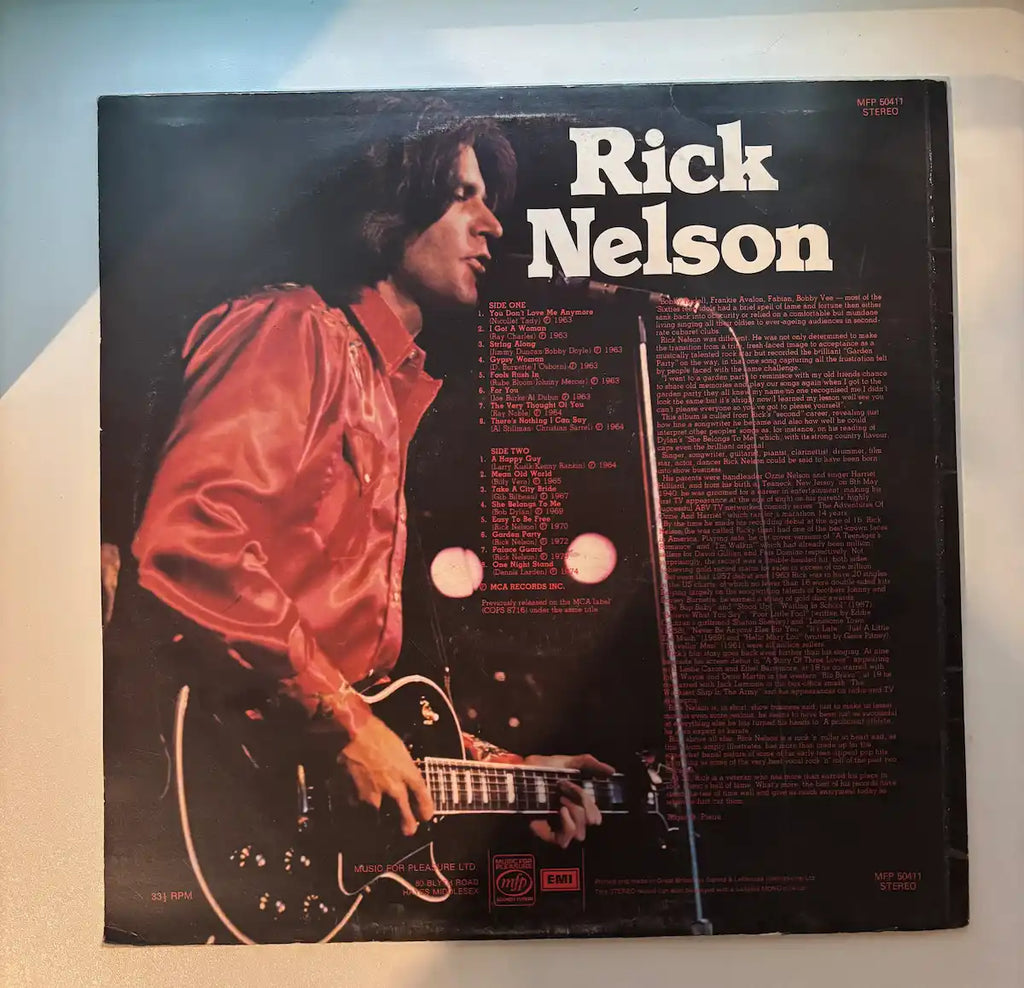 The Rick Nelson Singles 1963-1974 vinyl LP back cover track listing 1977 UK